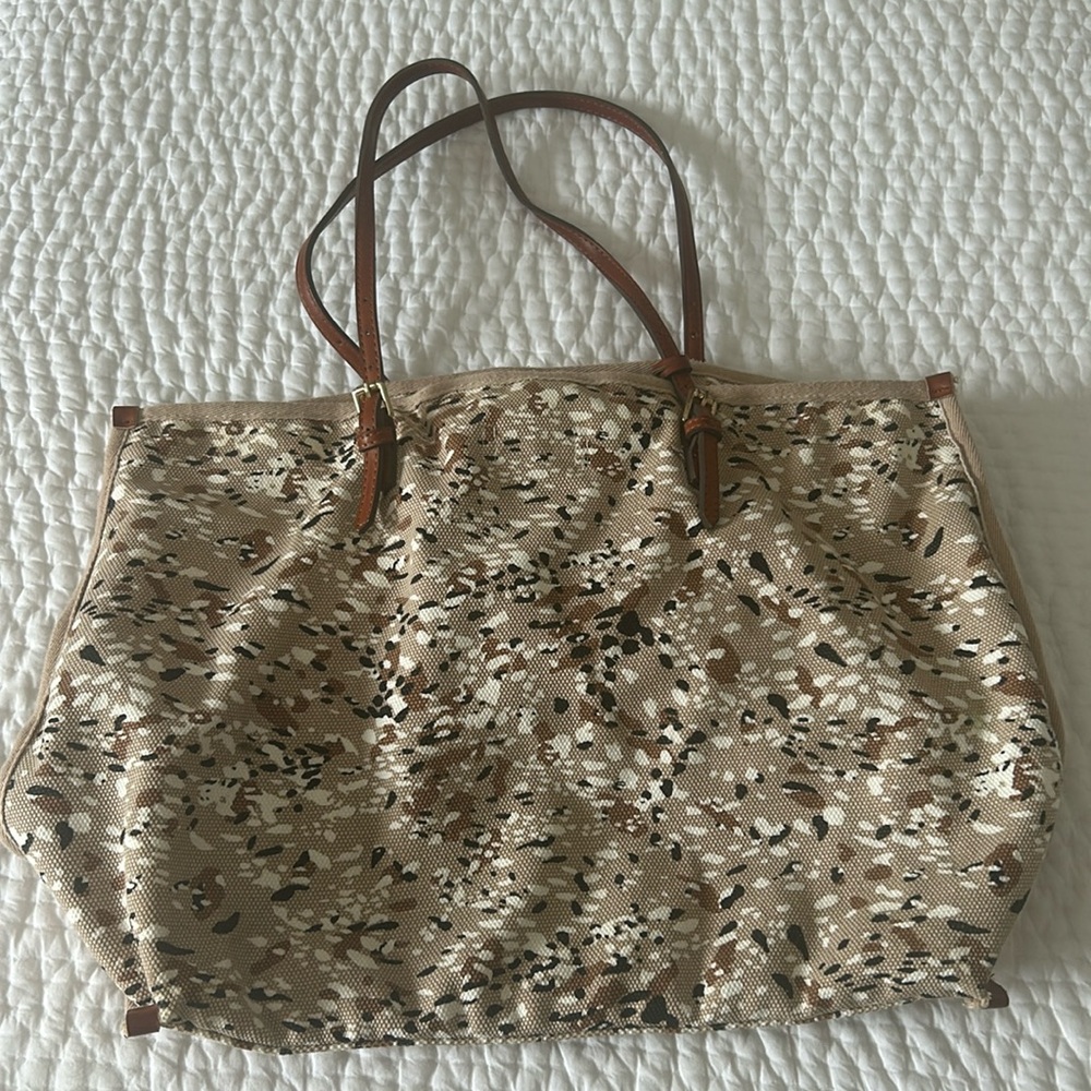 Tan canvas bag with pouch.
